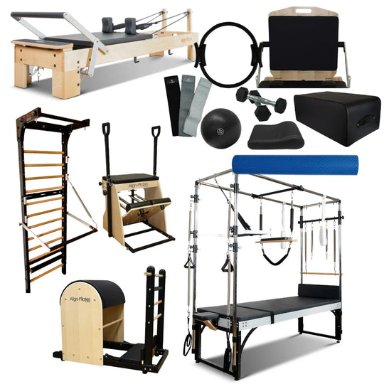 Collection of Pilates reformers, straps, weights, and other equipment on a white background