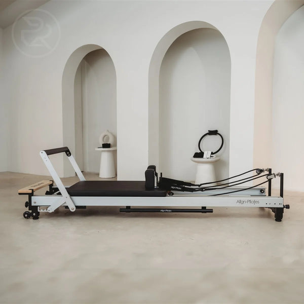 Align-Pilates reformer machine in a modern minimalist studio space