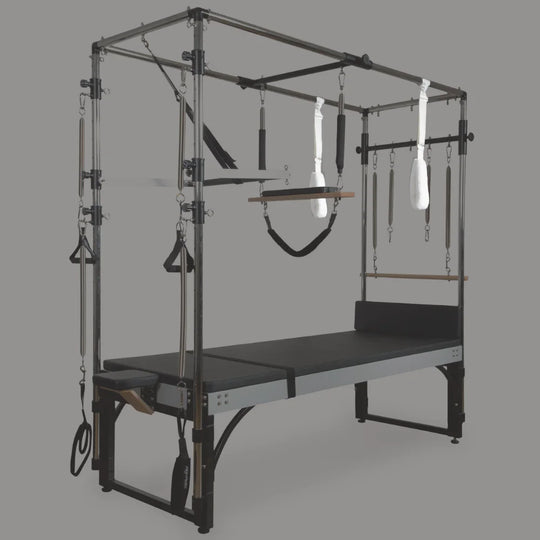 Pilates Cadillac with various attachments