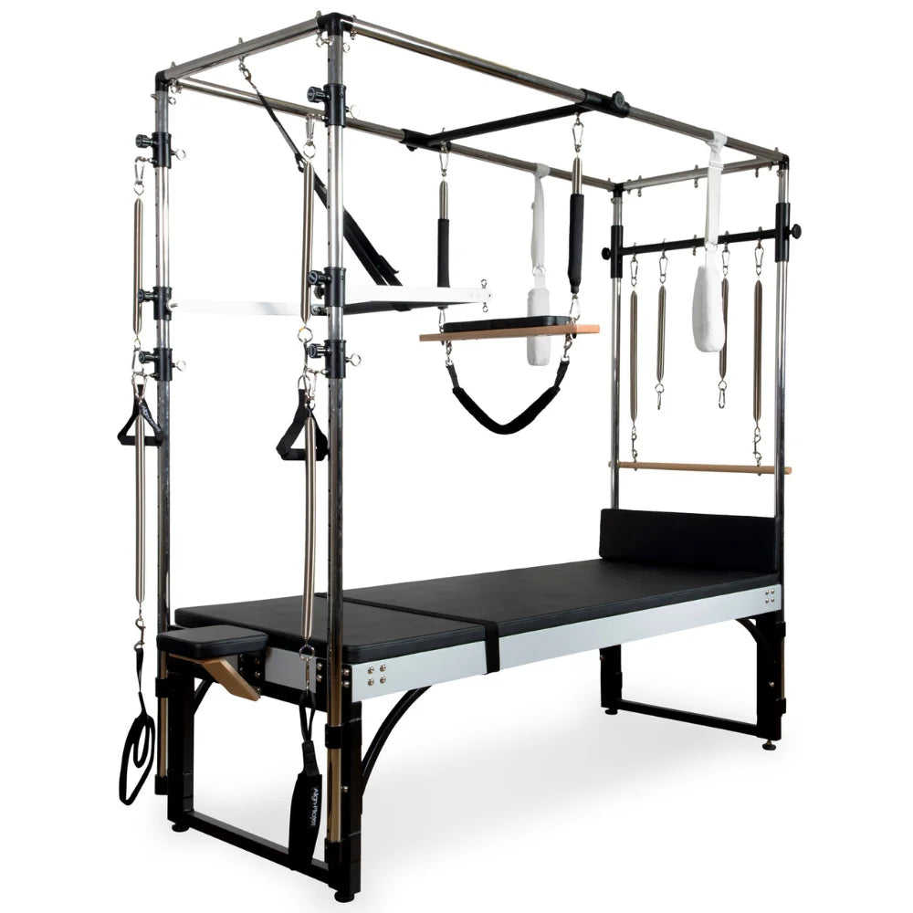 Pilates Cadillac with attachments on a white background