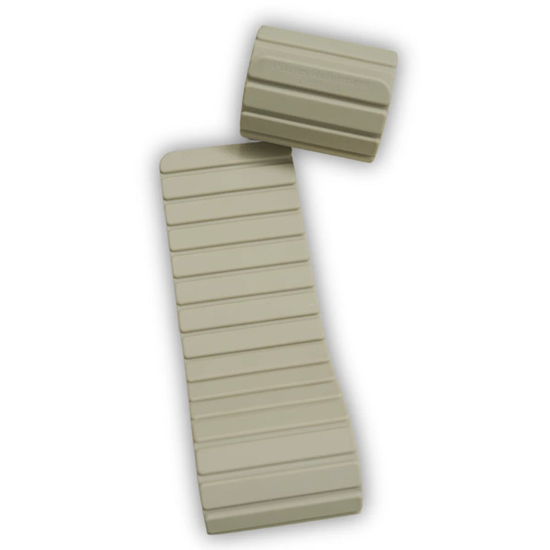 Two beige magnetic weights on a light surface