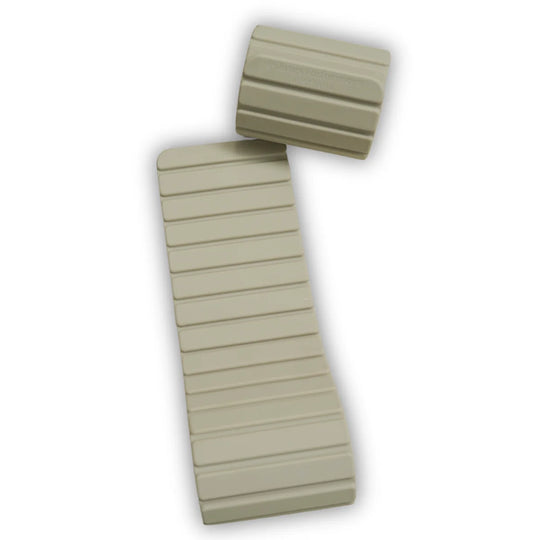 Two beige magnetic weights on a light surface