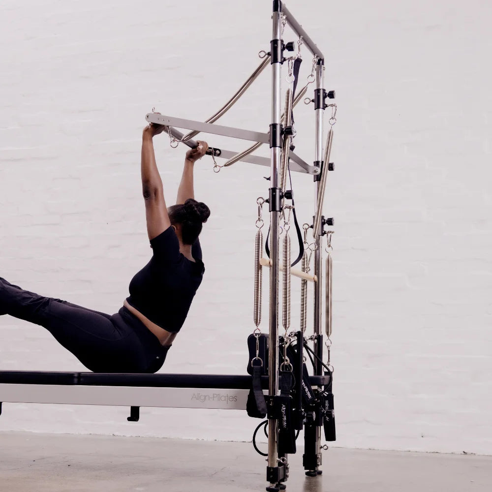 Person using a Pilates half trapeze