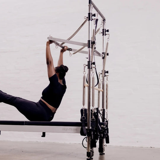 Person using a Pilates half trapeze