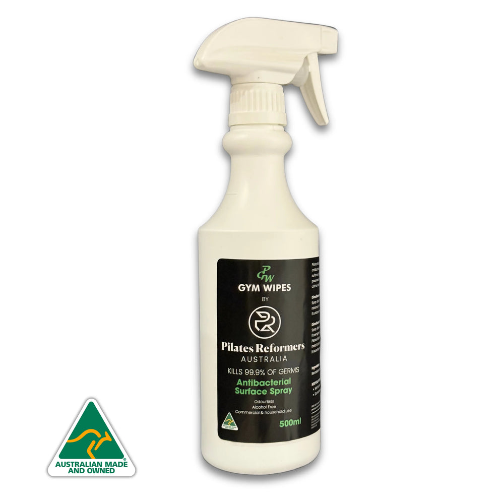 A white spray bottle with a label that reads 'PGW Anti-Bacterial Surface Spray', indicating it is designed for gym use and is alcohol-free.