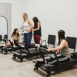 Group of women undergoing Pilates instructor training